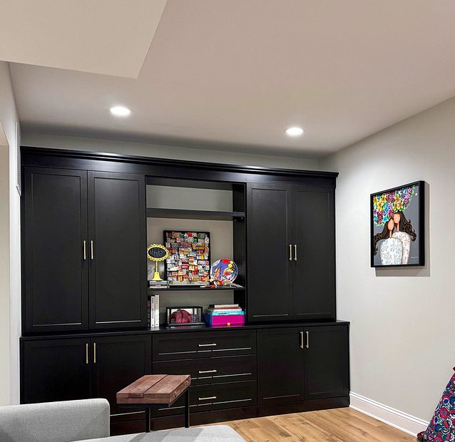 Playroom with black cabinetry wall unit